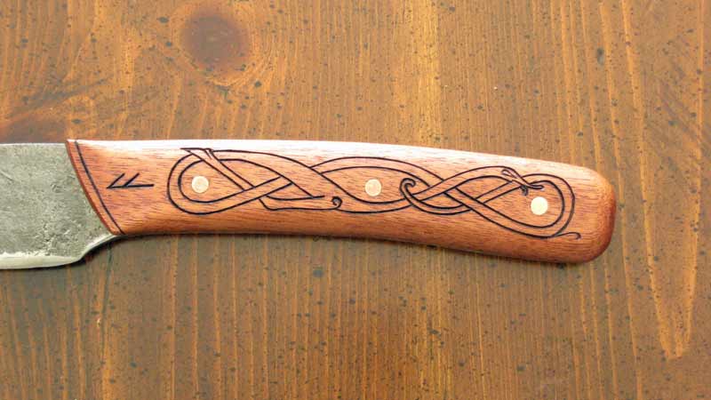 hardwood grips with burned details and copper rivits.