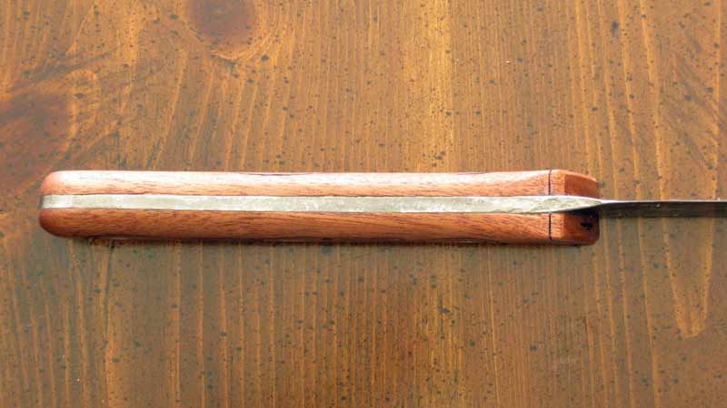 Grips fit to hammer marks on tang.